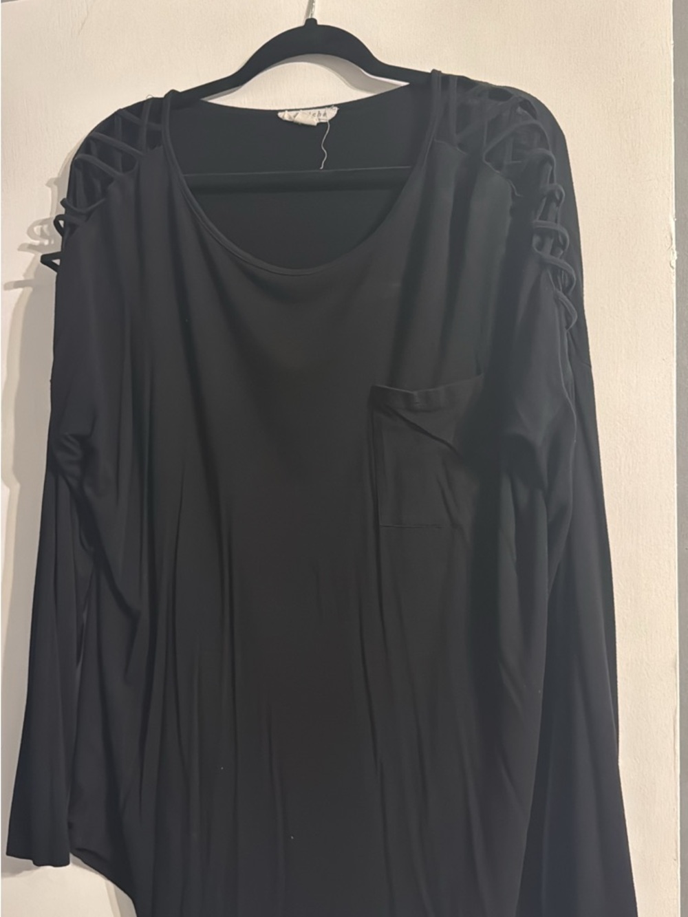 Black long sleeve crisscross on shoulders